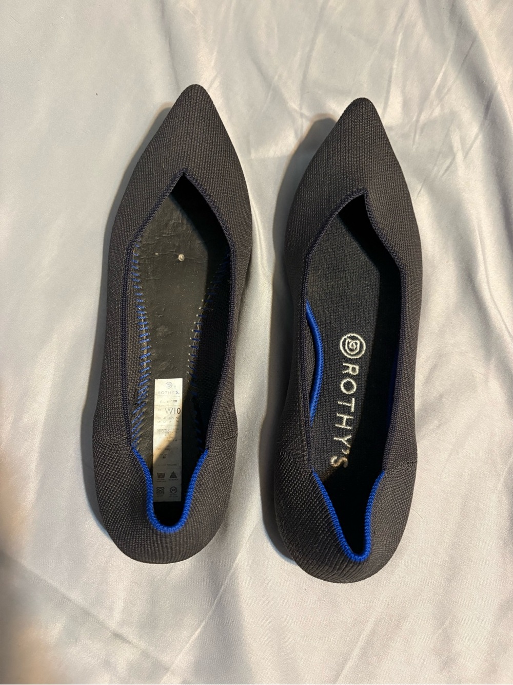 Rothy's Pointed Knit Flats in Black with Blue Trim